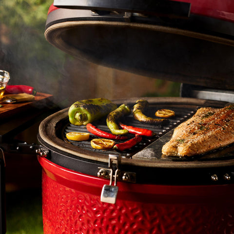Kamado Joe black finish adds classic grill aesthetic.
