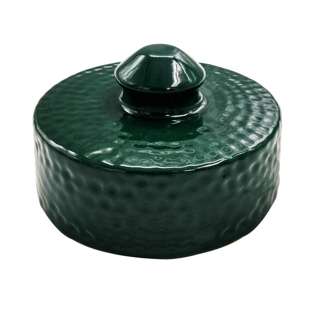 Kamaster ceramic grill top in action on a Big Green Egg during a family cookout.