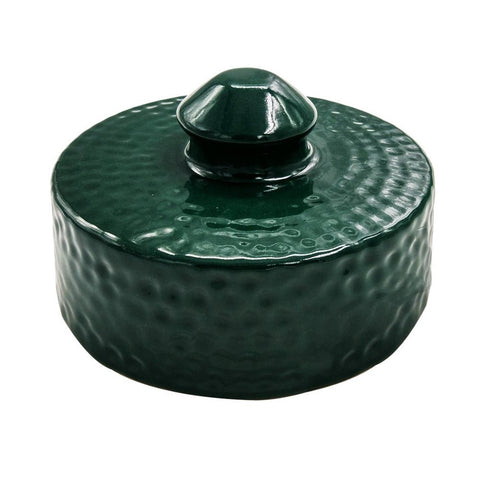 Kamaster ceramic grill top in action on a Big Green Egg during a family cookout.