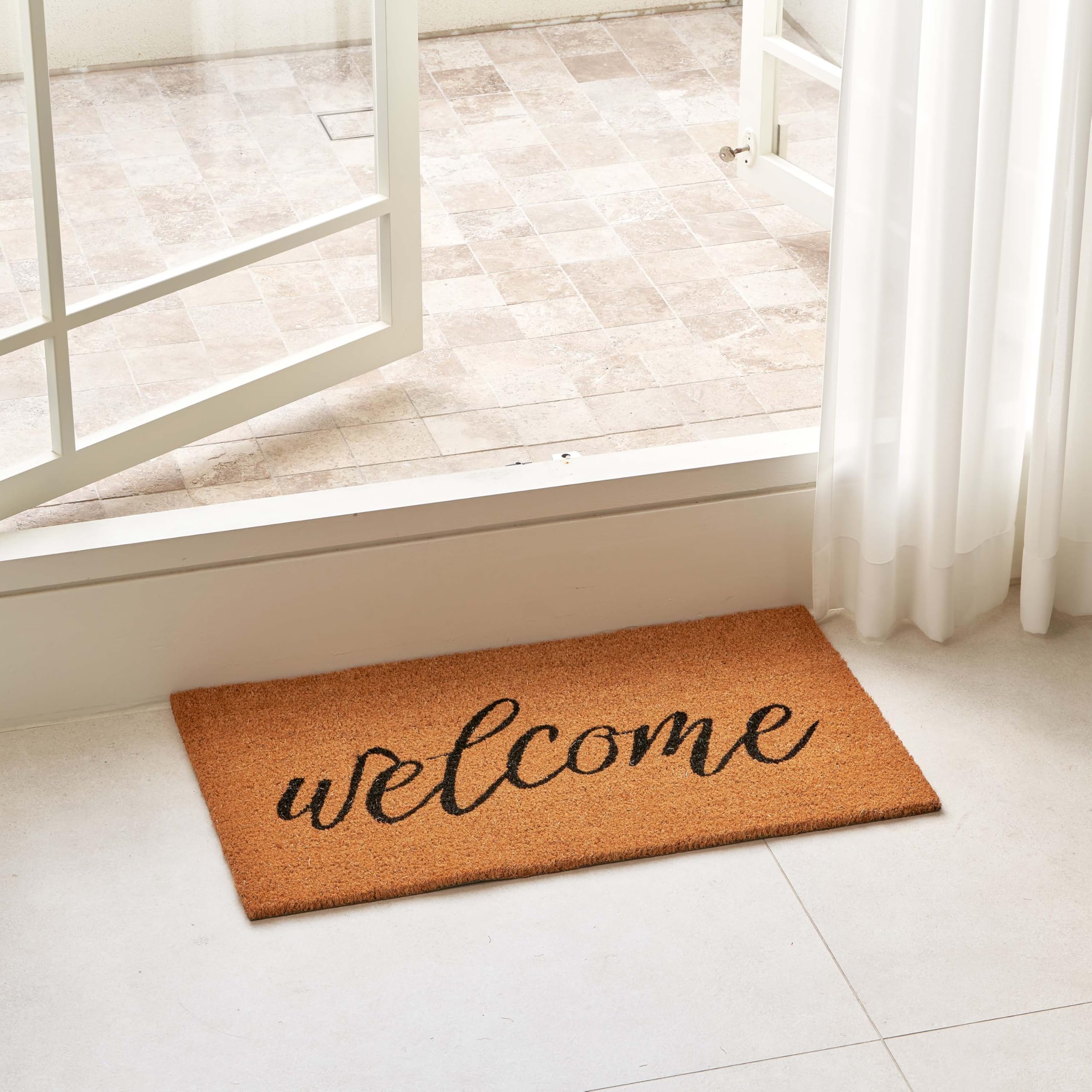 KANKUN Coco Coir Doormat close-up bristles scraping dirt at the doorstep