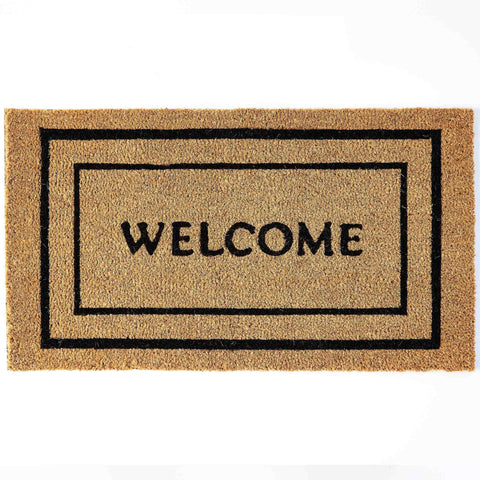 KANKUN Coco Coir Doormat at front door showing dirt scraping action