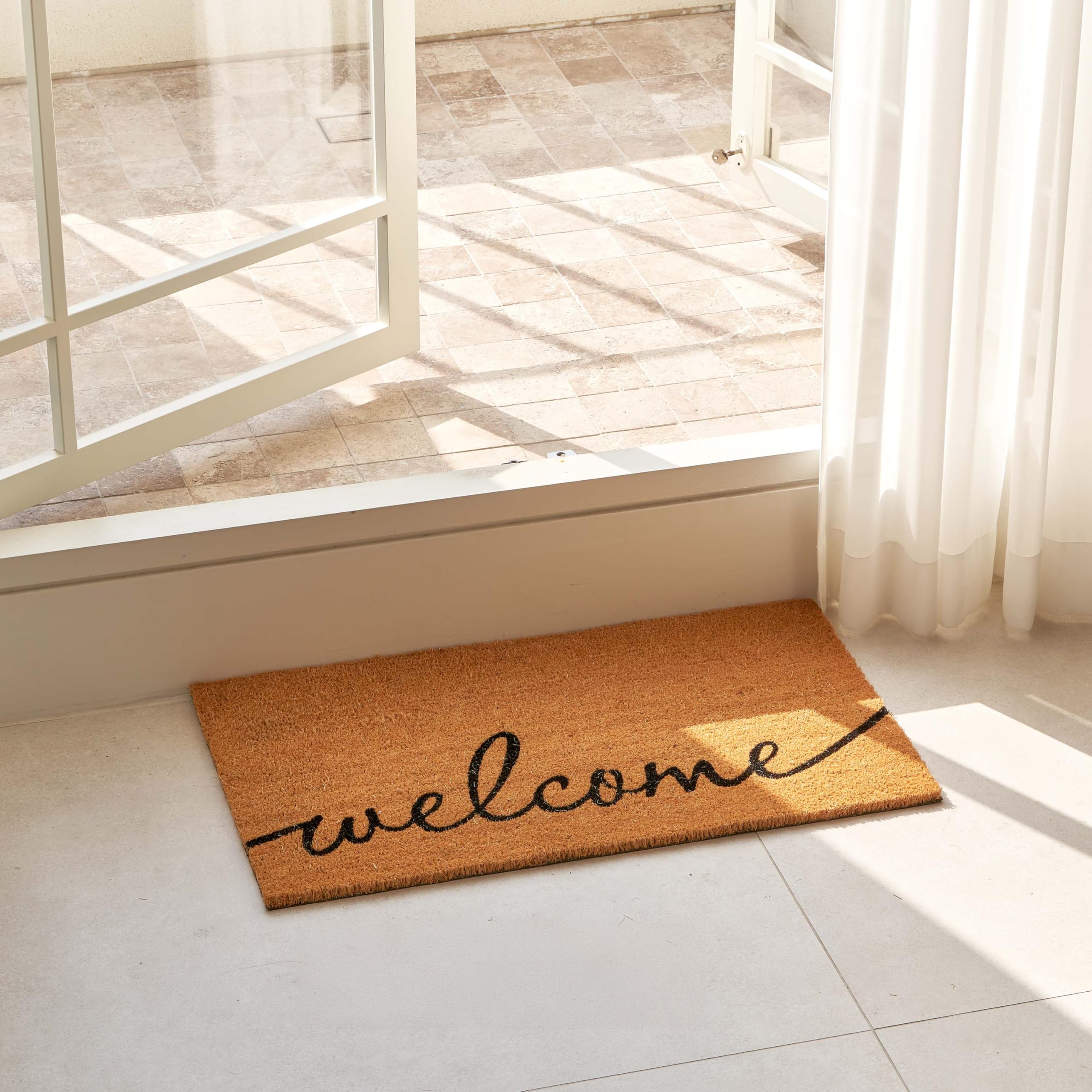 KANKUN door mat with heavy backing stays flat in busy entryways.
