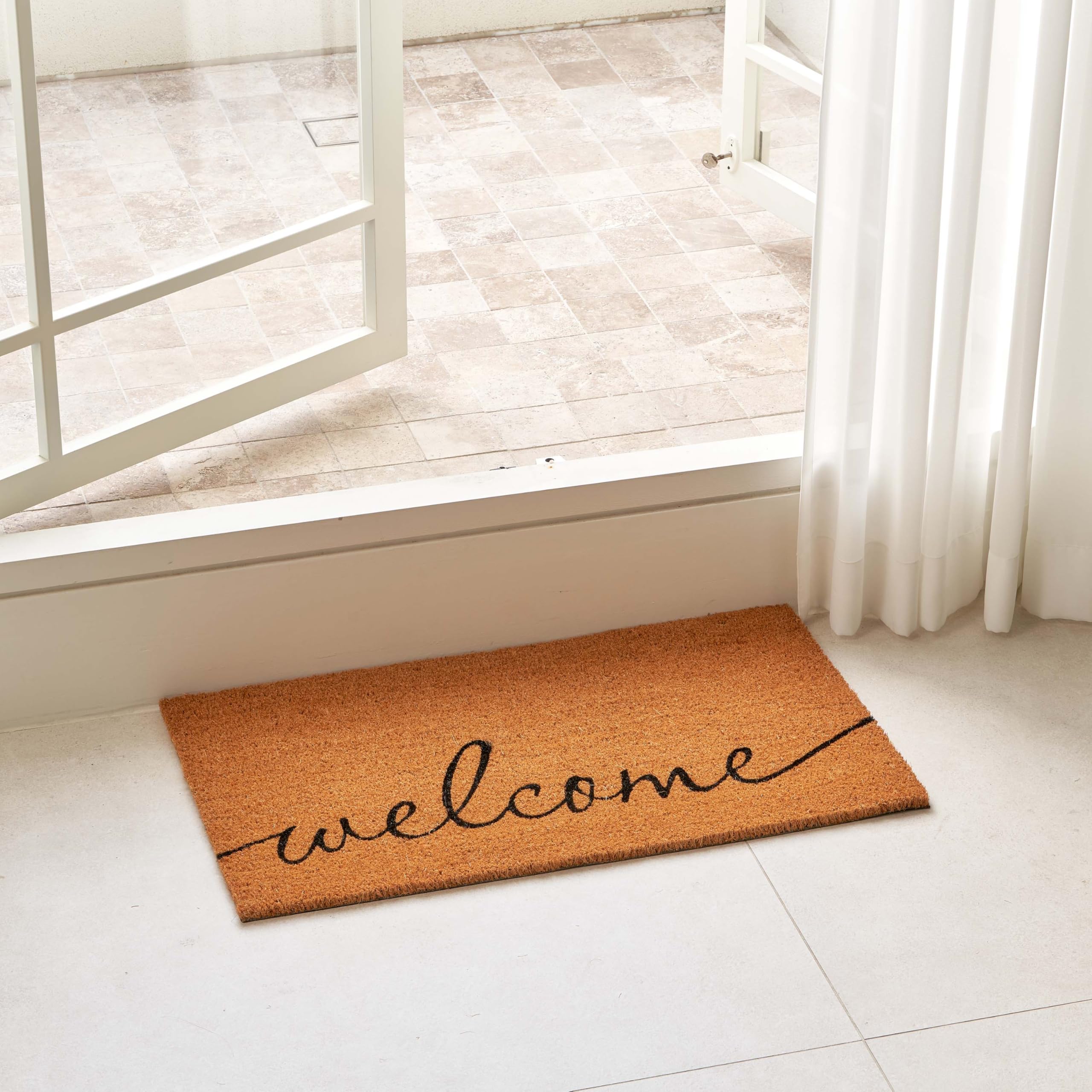 Natural fiber texture of KANKUN mat on a clean hallway floor