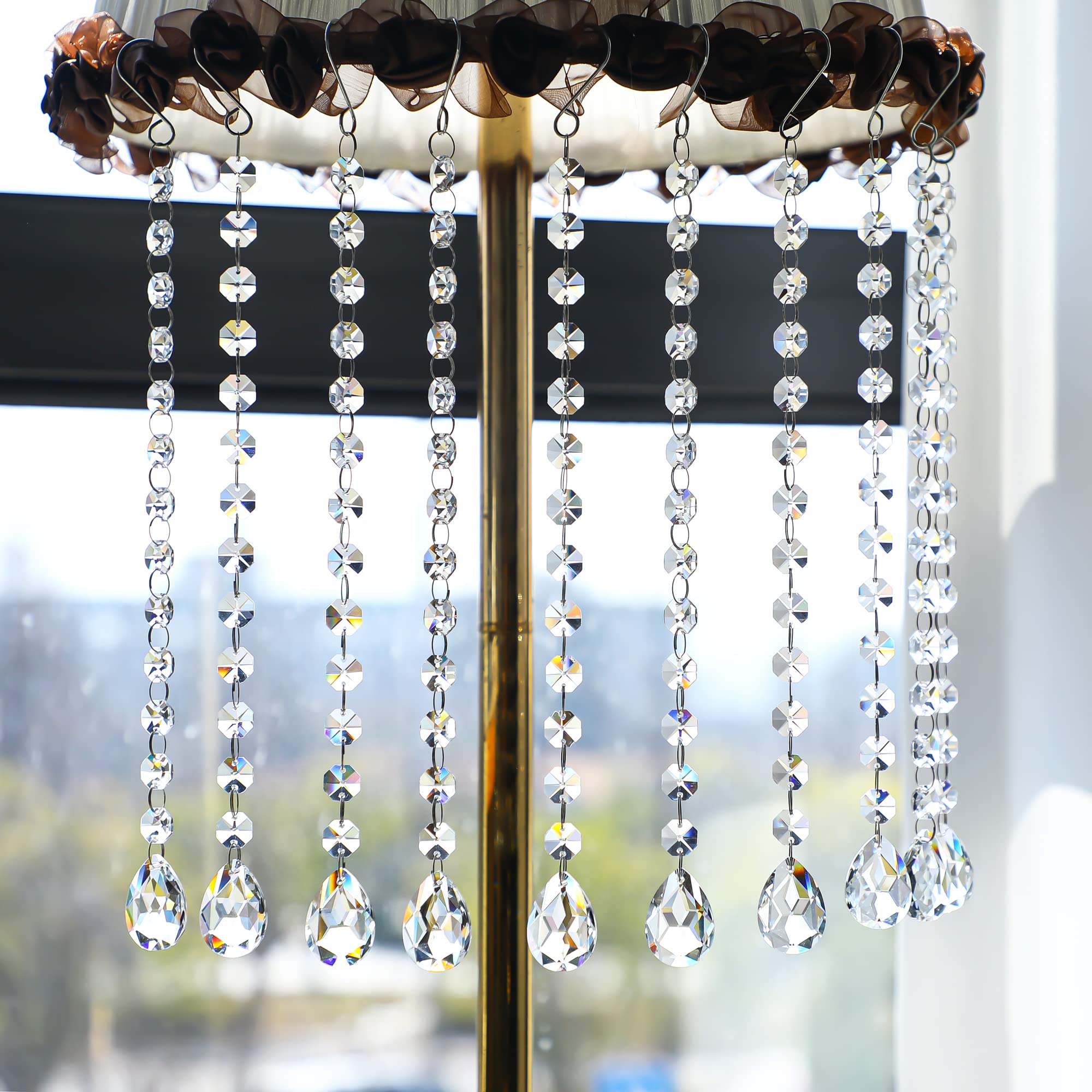 Kanpura 38mm crystal prisms reflect rainbow light for festive centerpieces.