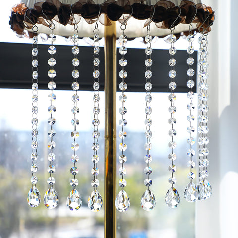 Kanpura 38mm crystal prisms reflect rainbow light for festive centerpieces.