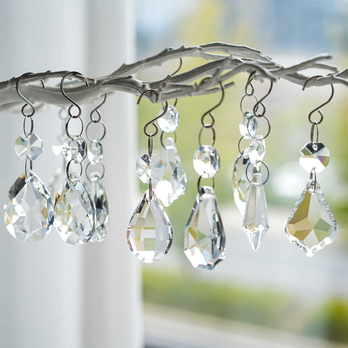 Kanpura crystal prisms varied shapes sparkle with rainbow reflections in sunlight