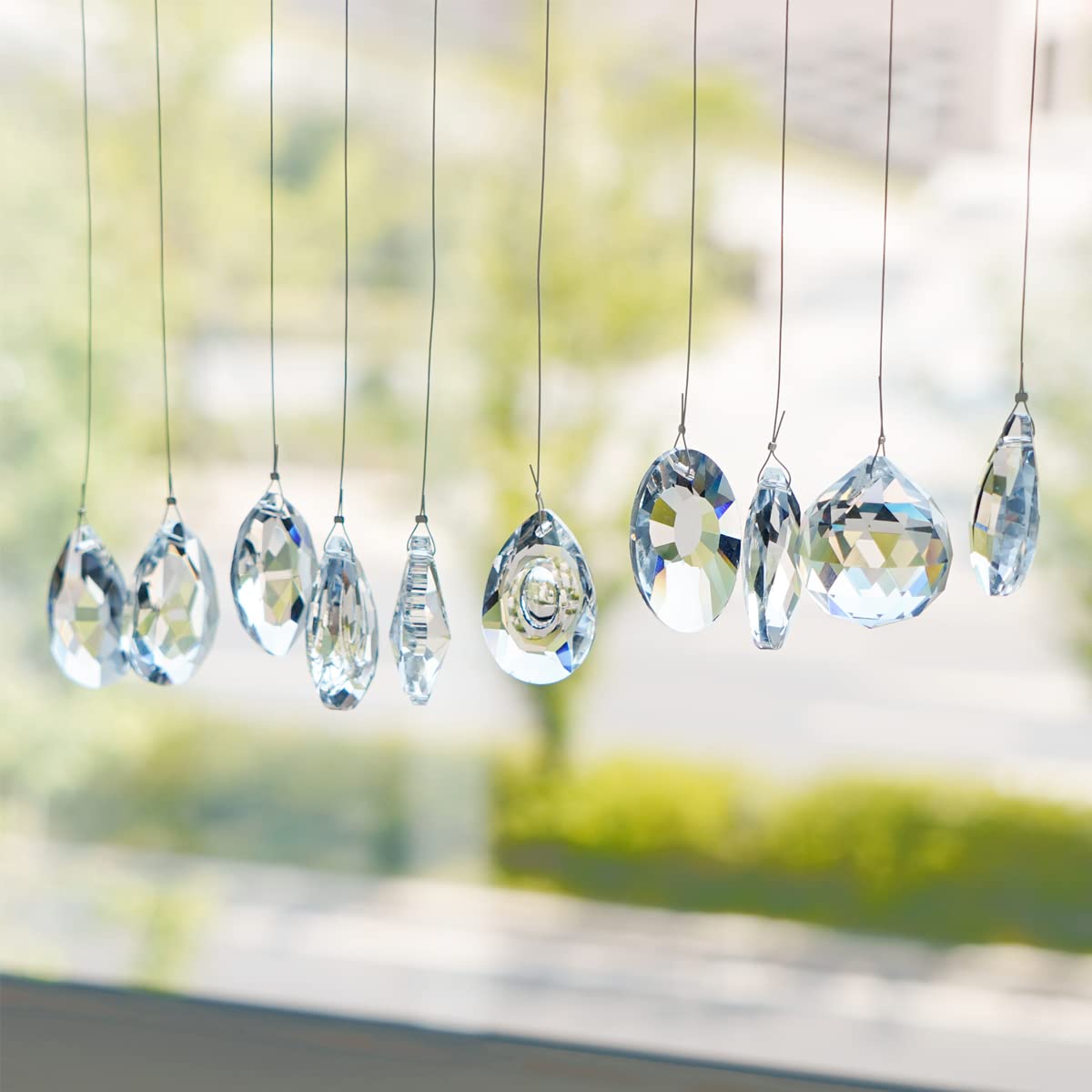 KANPURA longan drop sun catcher with rainbow light reflections