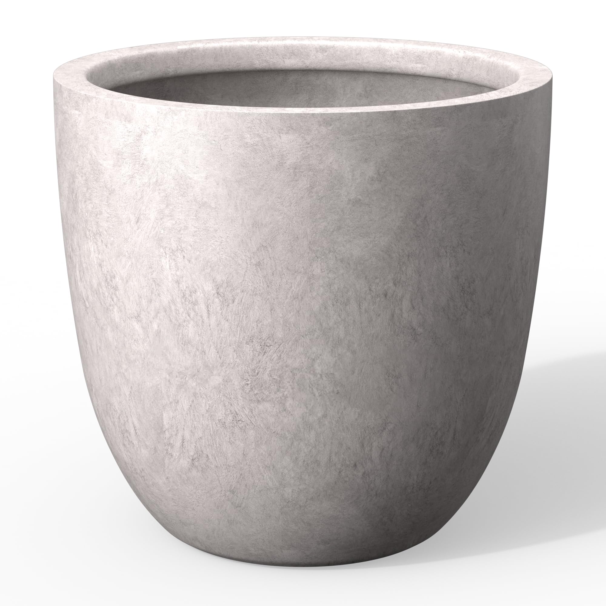 Kante 14-inch round concrete planter with lion head embossing adds bold focal point