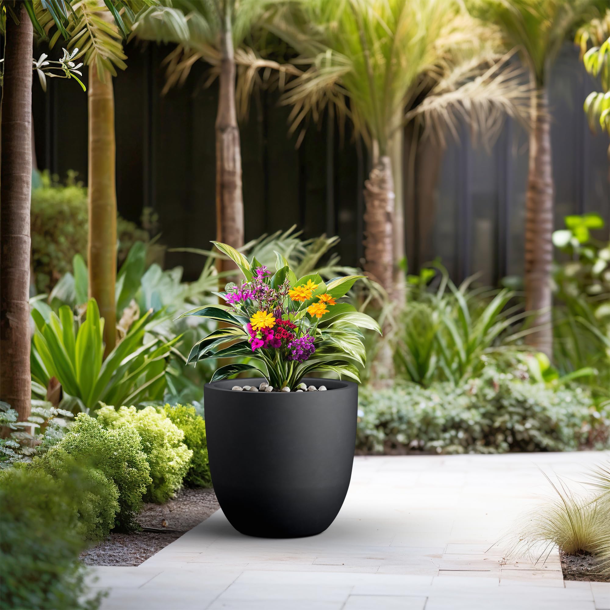 Kante 18-inch round planter on patio illustrating weather-resistant surface.