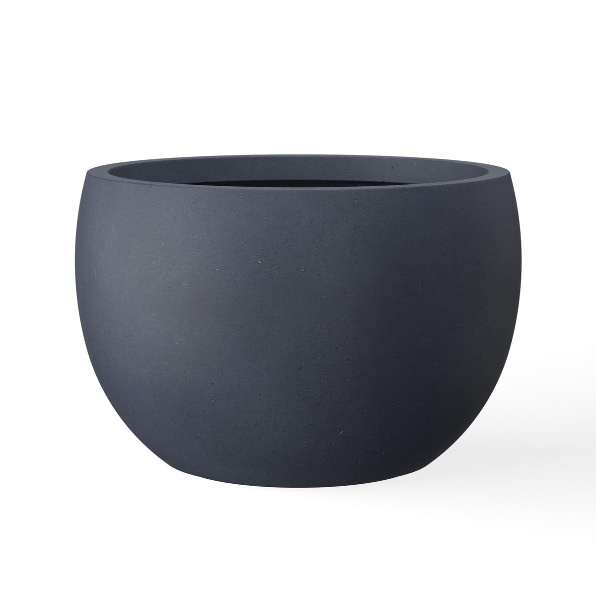 Kante 19.9-inch round concrete planter with authentic texture for durable outdoor accents.