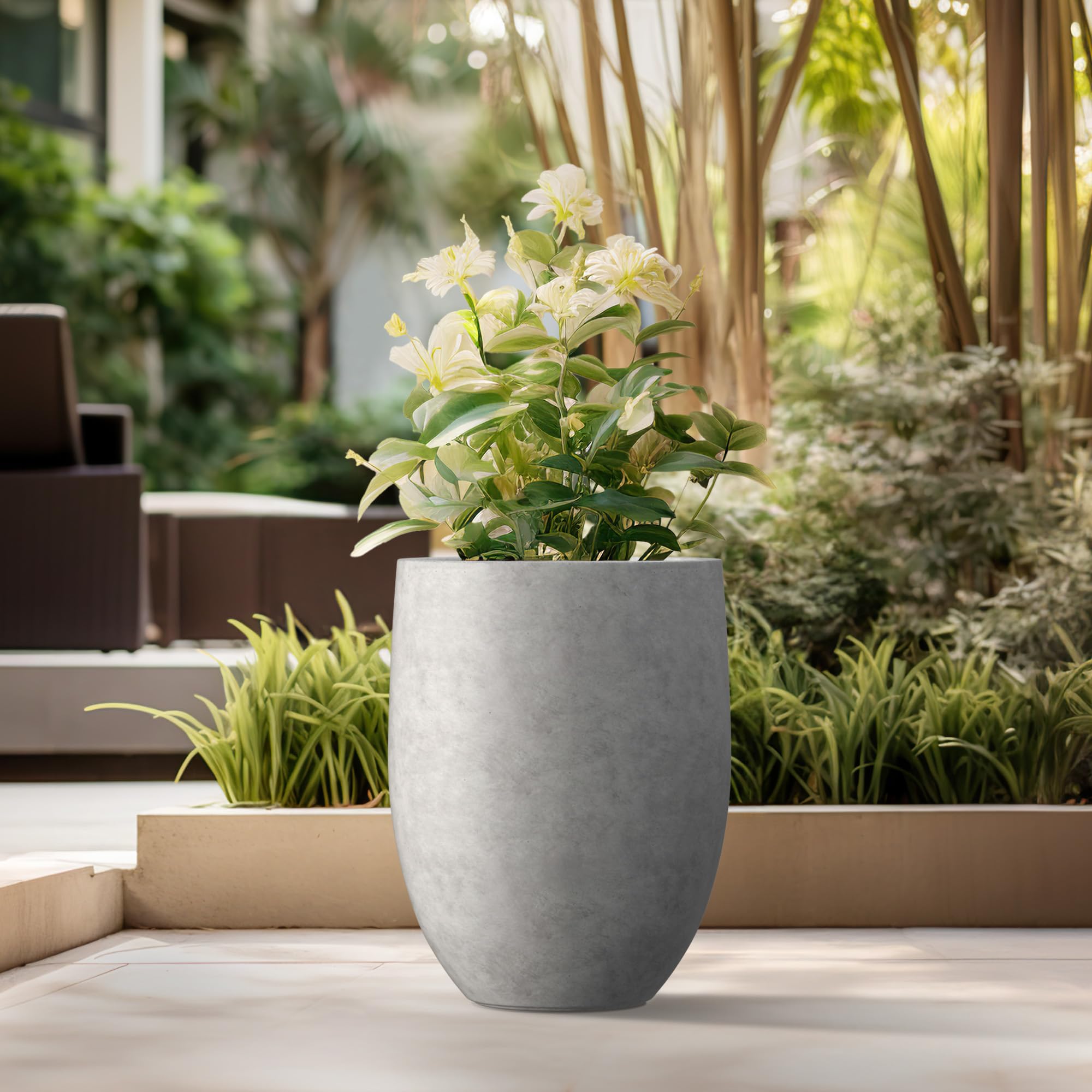 Indoor display of Kante concrete tall planter in a modern room