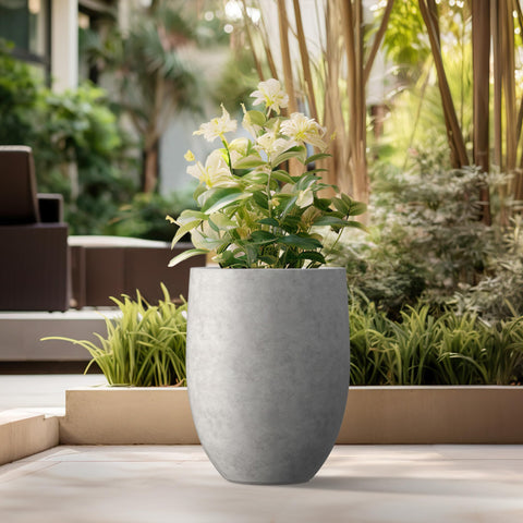 Indoor display of Kante concrete tall planter in a modern room