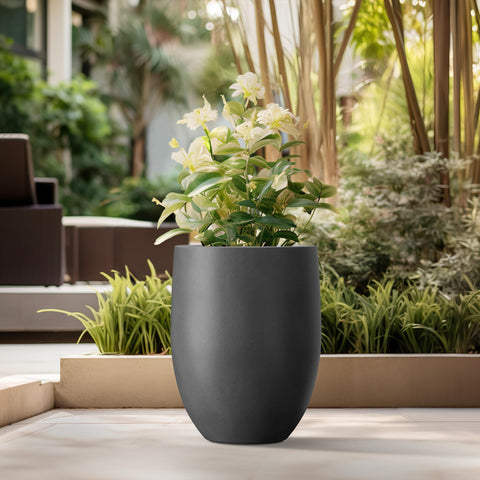 Kante planter features drainage hole and rubber plug for easy water management.