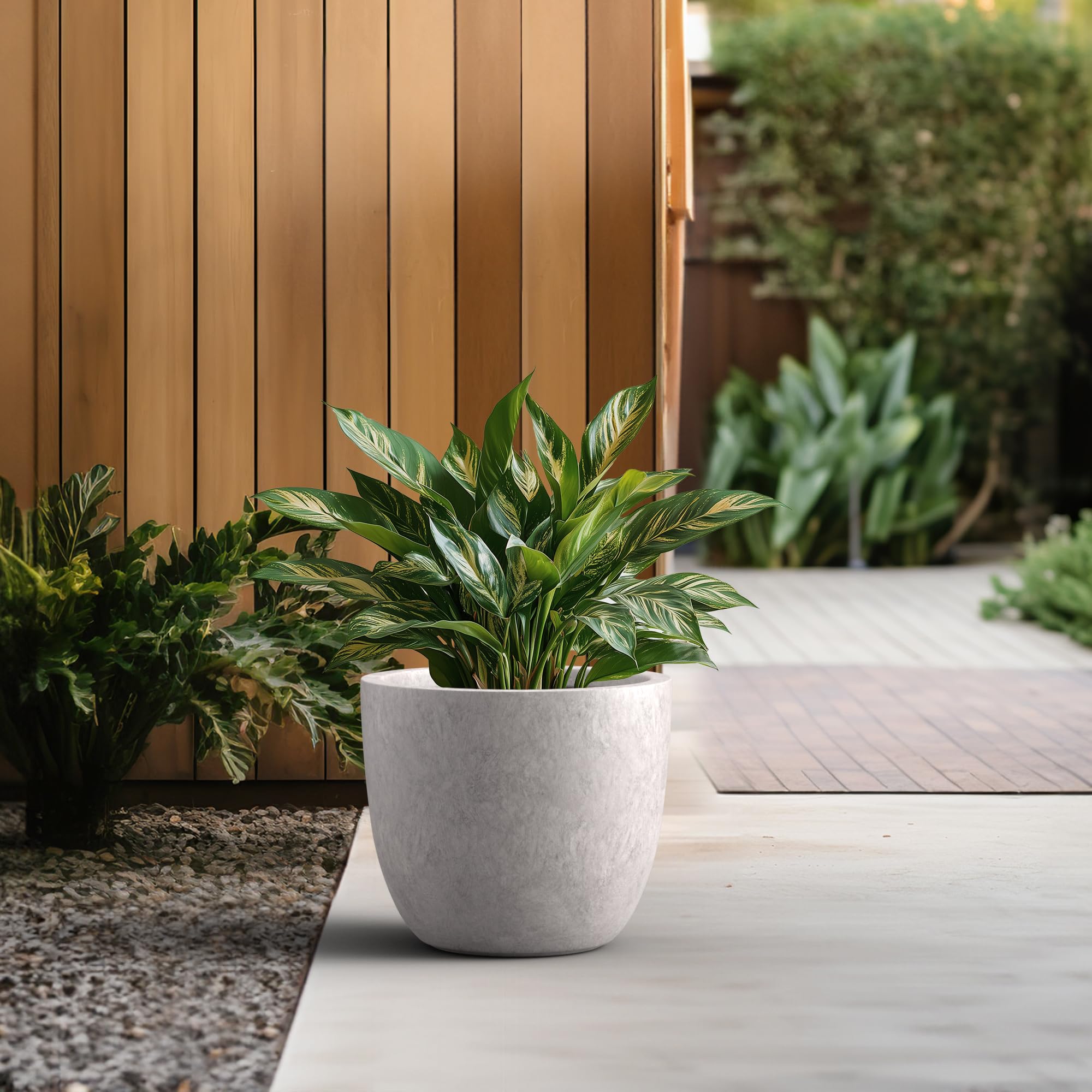 Kante indoor outdoor planter includes rubber plug for flexible placement