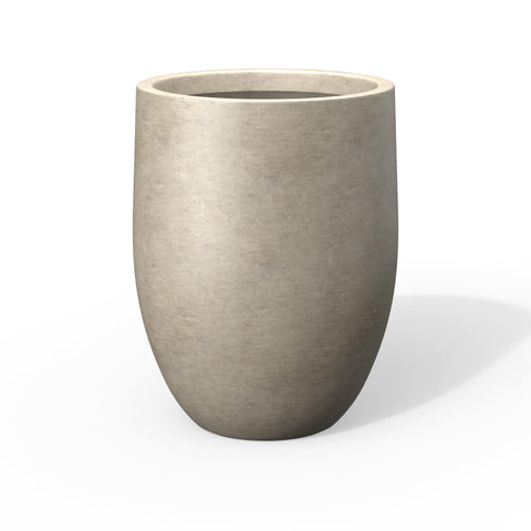 Kante tall concrete planter with weathered finish enhances outdoor spaces