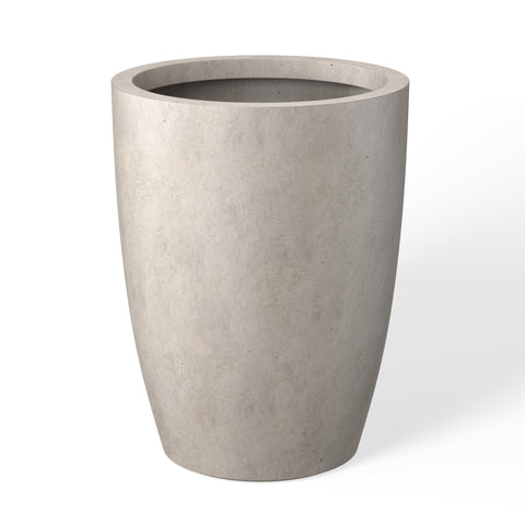 kante tall round concrete planter with weathered finish enhances indoor and outdoor spaces