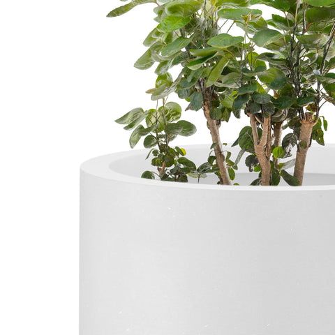 Kante round planter with visible pores adds organic texture to decor.
