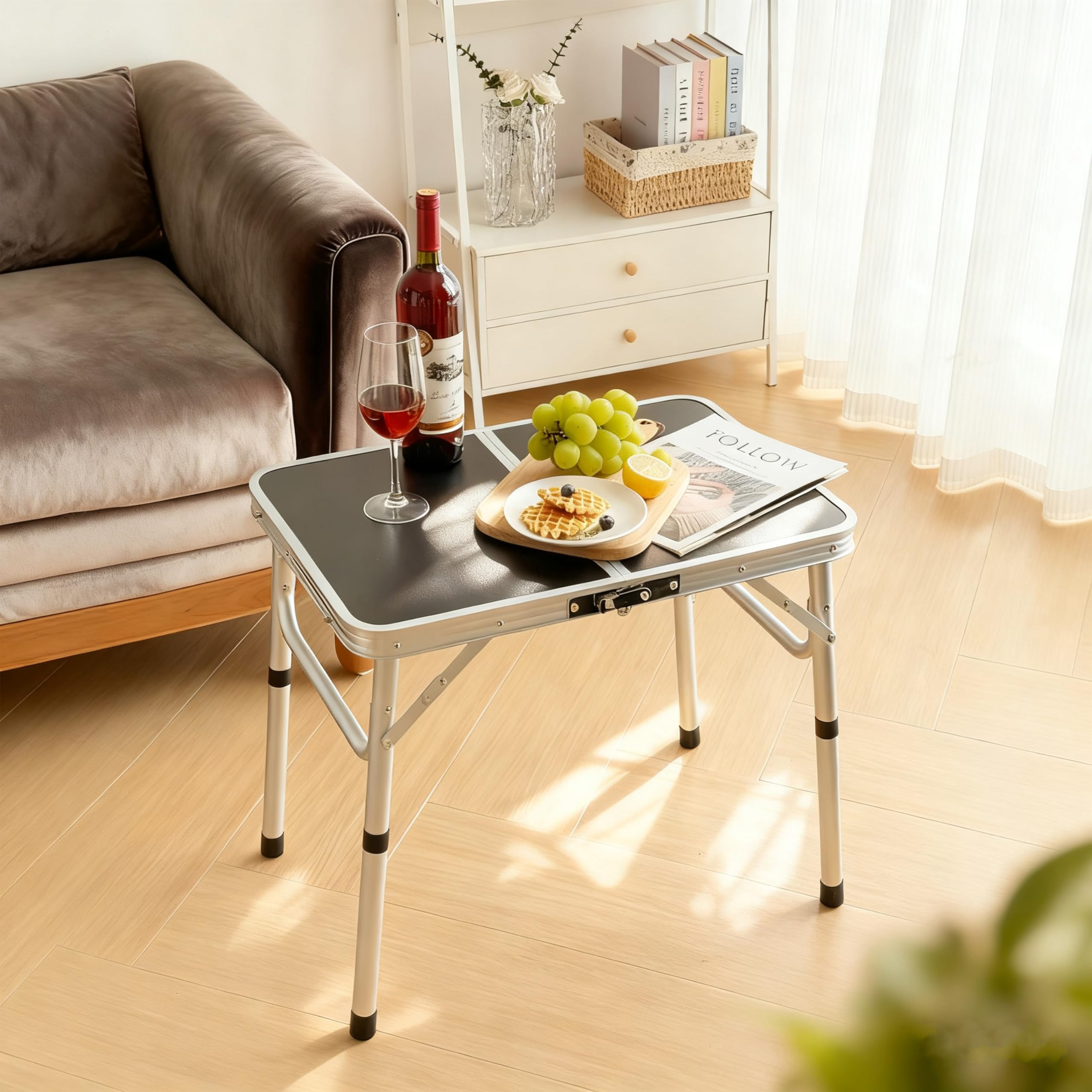 Kcmploro folding picnic table with built-in carry handle for easy transport.
