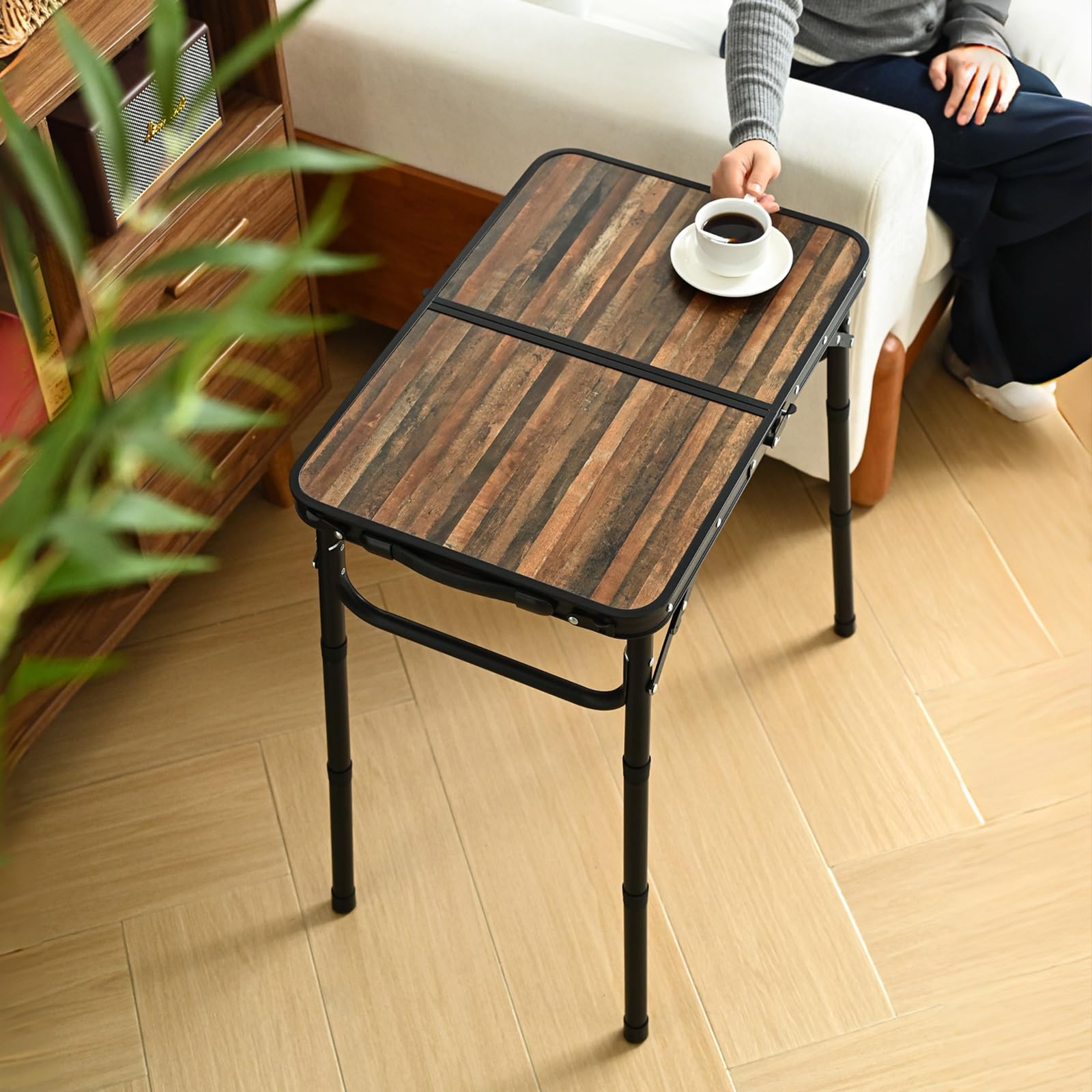 Kcmploro table with cloth pouch storage keeps utensils organized outdoors.