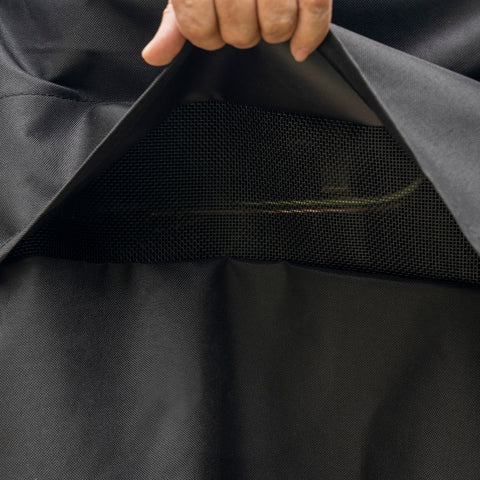 Kenmore 56-inch grill cover waterproof material withstands rain and splashes.