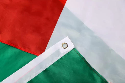 Kesysova flag with brass grommets adds durable hanging hardware for outdoor display.