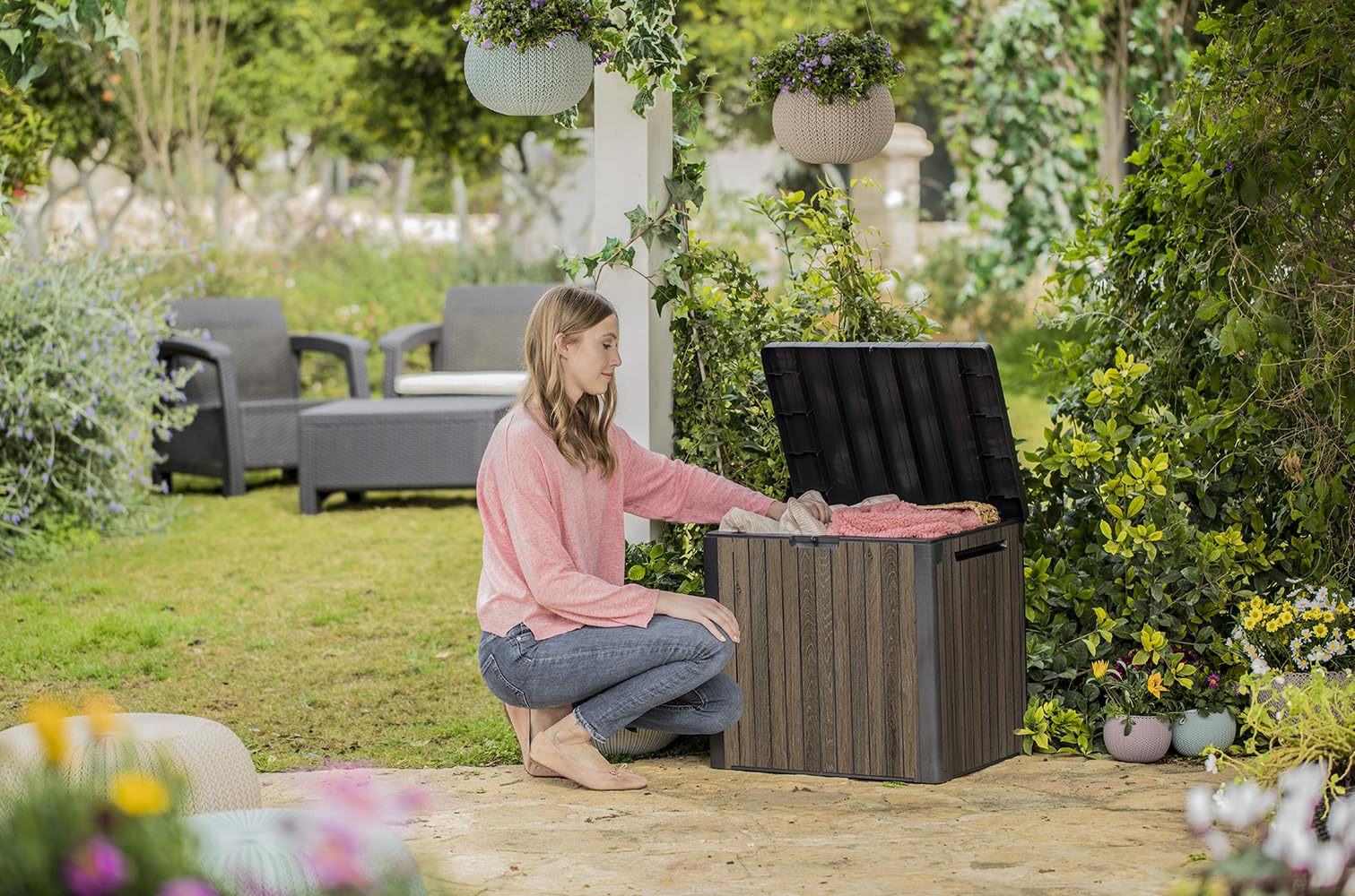 Keter Signature Everwood storage box showing organized outdoor essentials inside