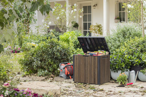 Keter Signature Everwood box doubles as outdoor seat near patio