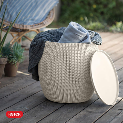 Patio setup featuring the Keter Urban Knit table and poufs.