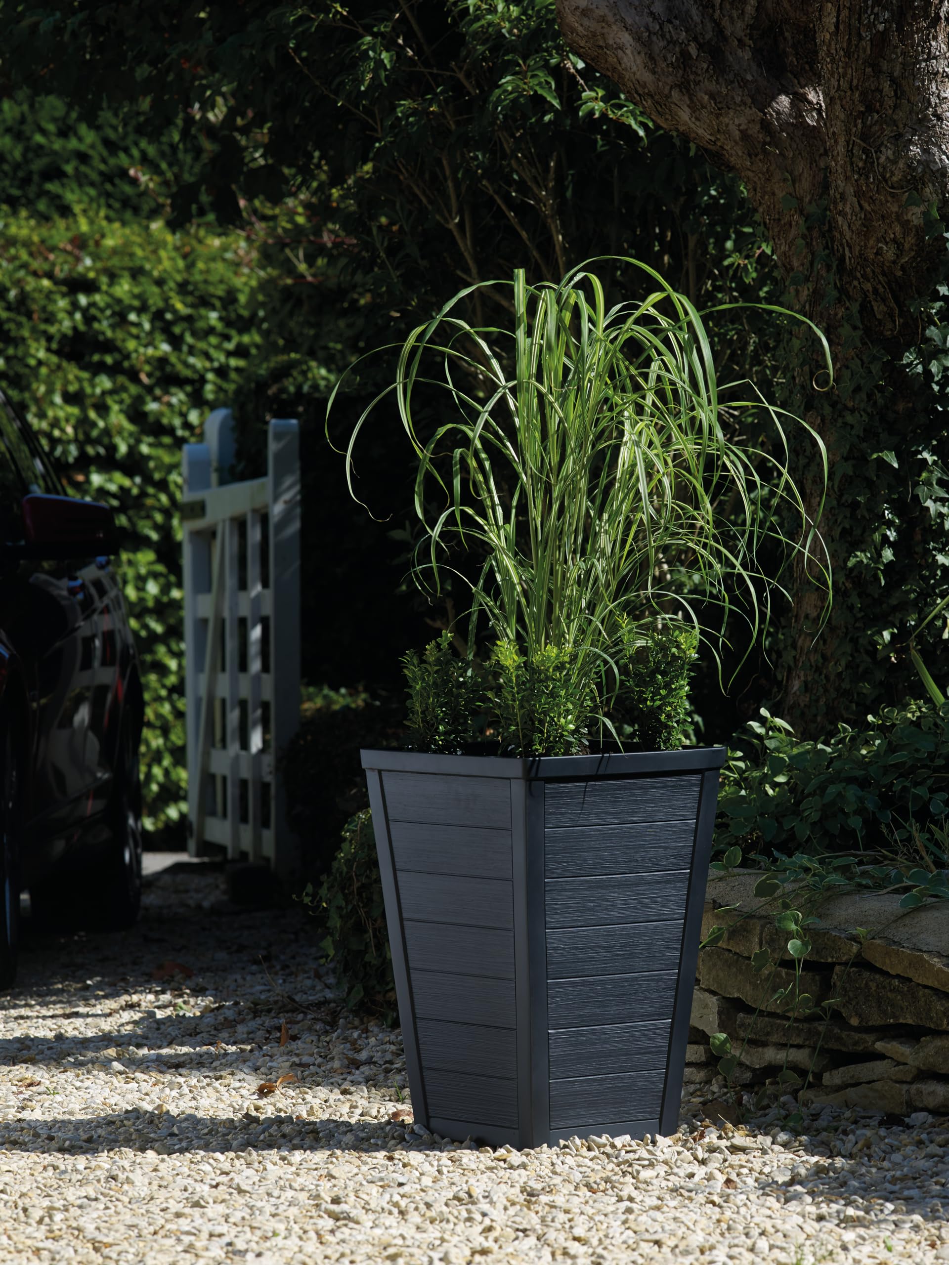 Keter wood-look tapered planter graphite entryway focal point.
