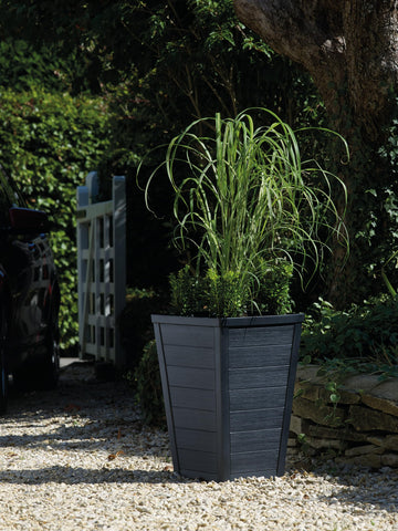 Keter wood-look tapered planter graphite entryway focal point.