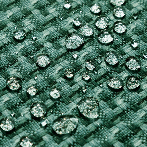Kevin Textile faux linen weave texture cover adds rustic charm to garden seating.