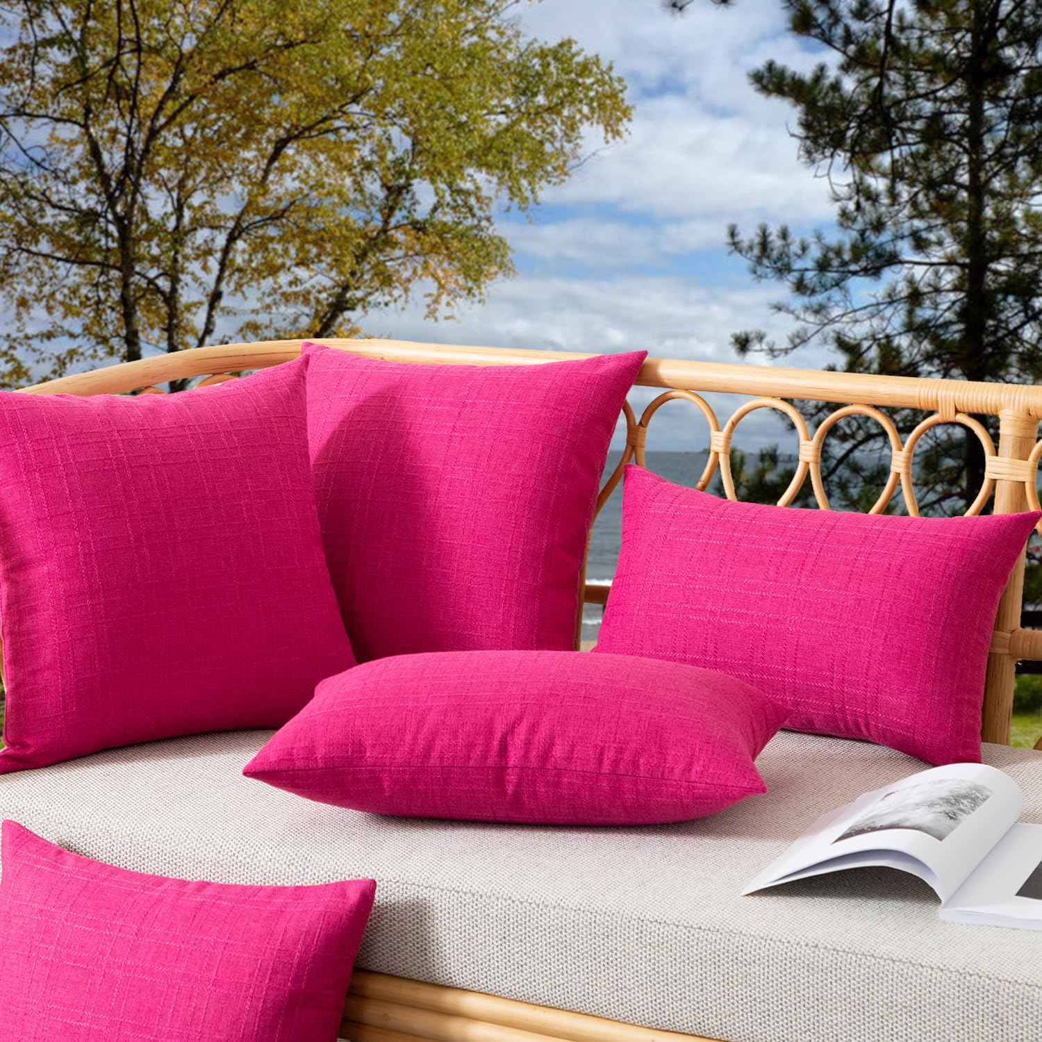 Kevin Textile Valentines 2-pack on couch or patio, showcasing vibrant hot pink color
