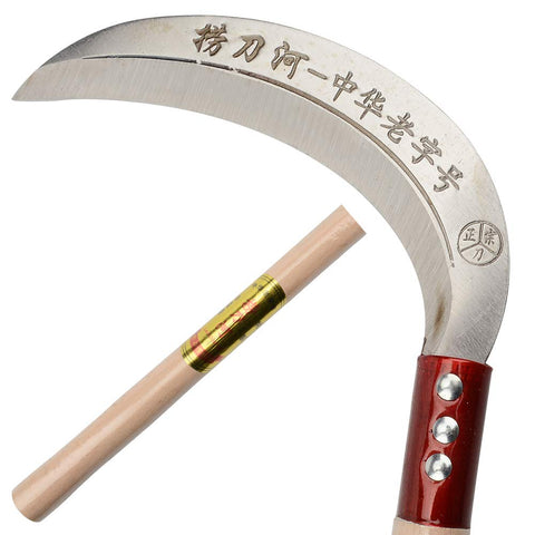 Keyi steel grass sickle in field cutting vines and weeds.