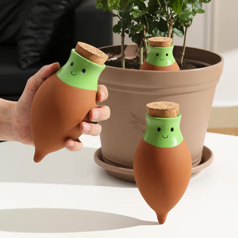 KGCCIZI Ollas water globes in a large pot delivering slow, even moisture