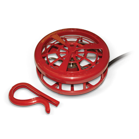K&H Pet Products deicer floats in a stock tank, keeping an open drinking area for livestock.