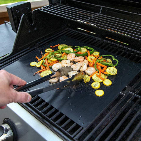 Easy-clean KICKOIL grill mats wiped with damp cloth