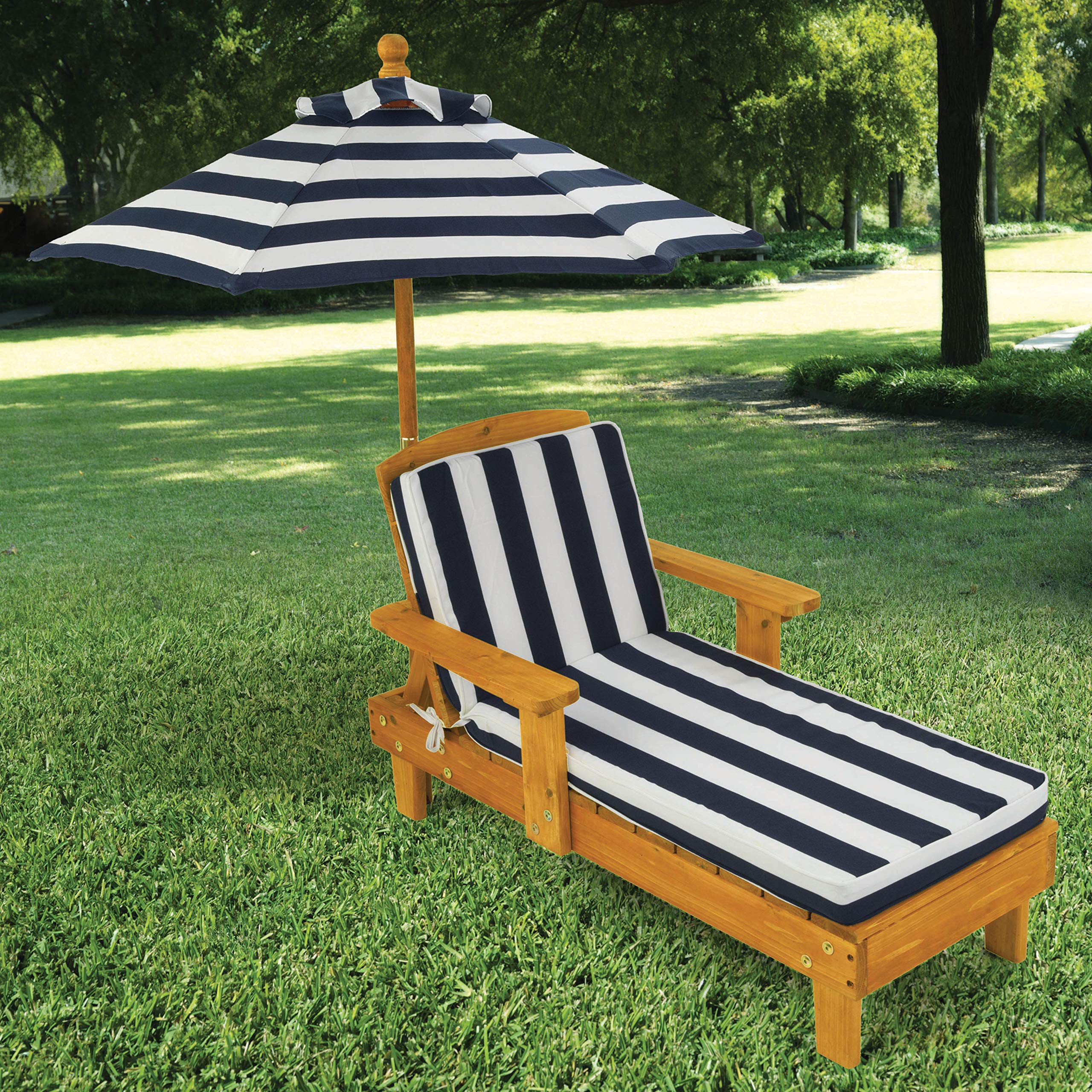 KidKraft outdoor chaise lounge with navy stripe umbrella provides shaded playtime outdoors.
