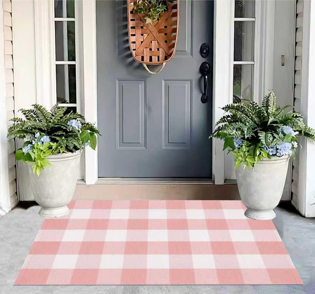KIhipIoe buffalo plaid outdoor rug pink and white on porch adds a welcoming touch
