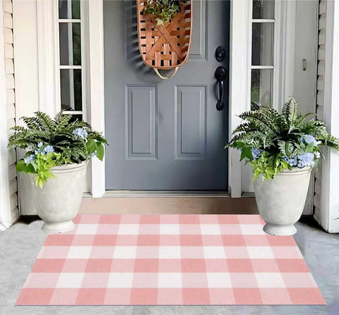 KIhipIoe buffalo plaid outdoor rug pink and white on porch adds a welcoming touch