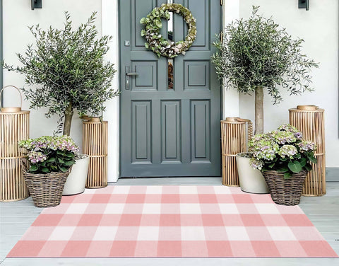 KIhipIoe pink and white buffalo plaid front porch rug enhances curb appeal and durability.