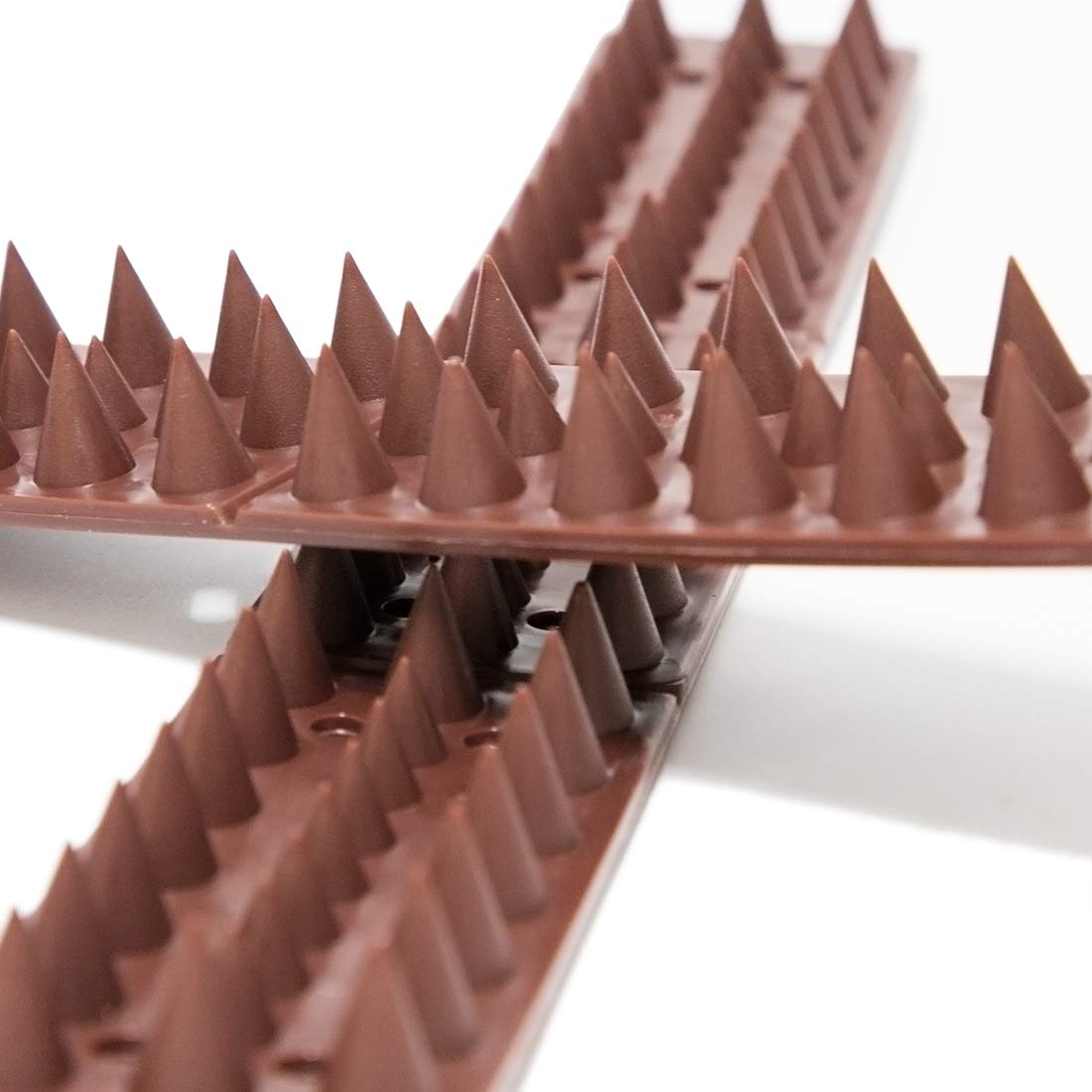 KIMANN brown spikes close-up showing durable plastic design for outdoor use.