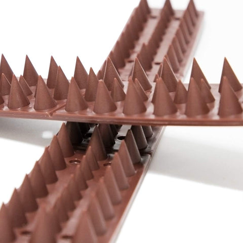 KIMANN brown spikes close-up showing durable plastic design for outdoor use.