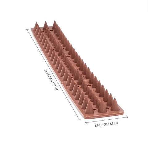 KIMANN spikes installed on fence line to deter intruders and birds.