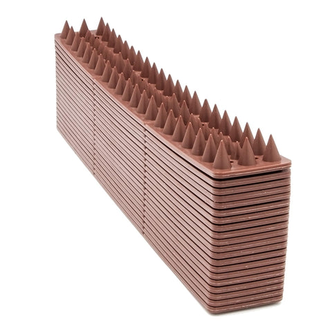 KIMANN spikes on roof edge protecting against raccoons and cats without harming wildlife.