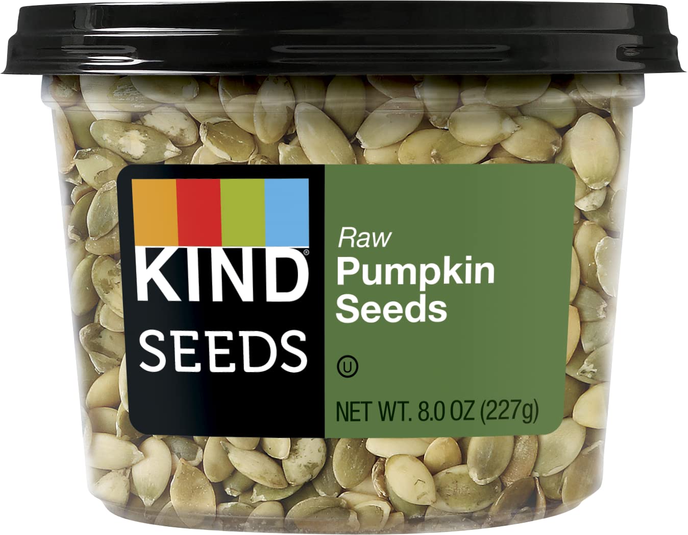 KIND Raw Pumpkin Seeds pouring to top salads for crunch and nutrition.