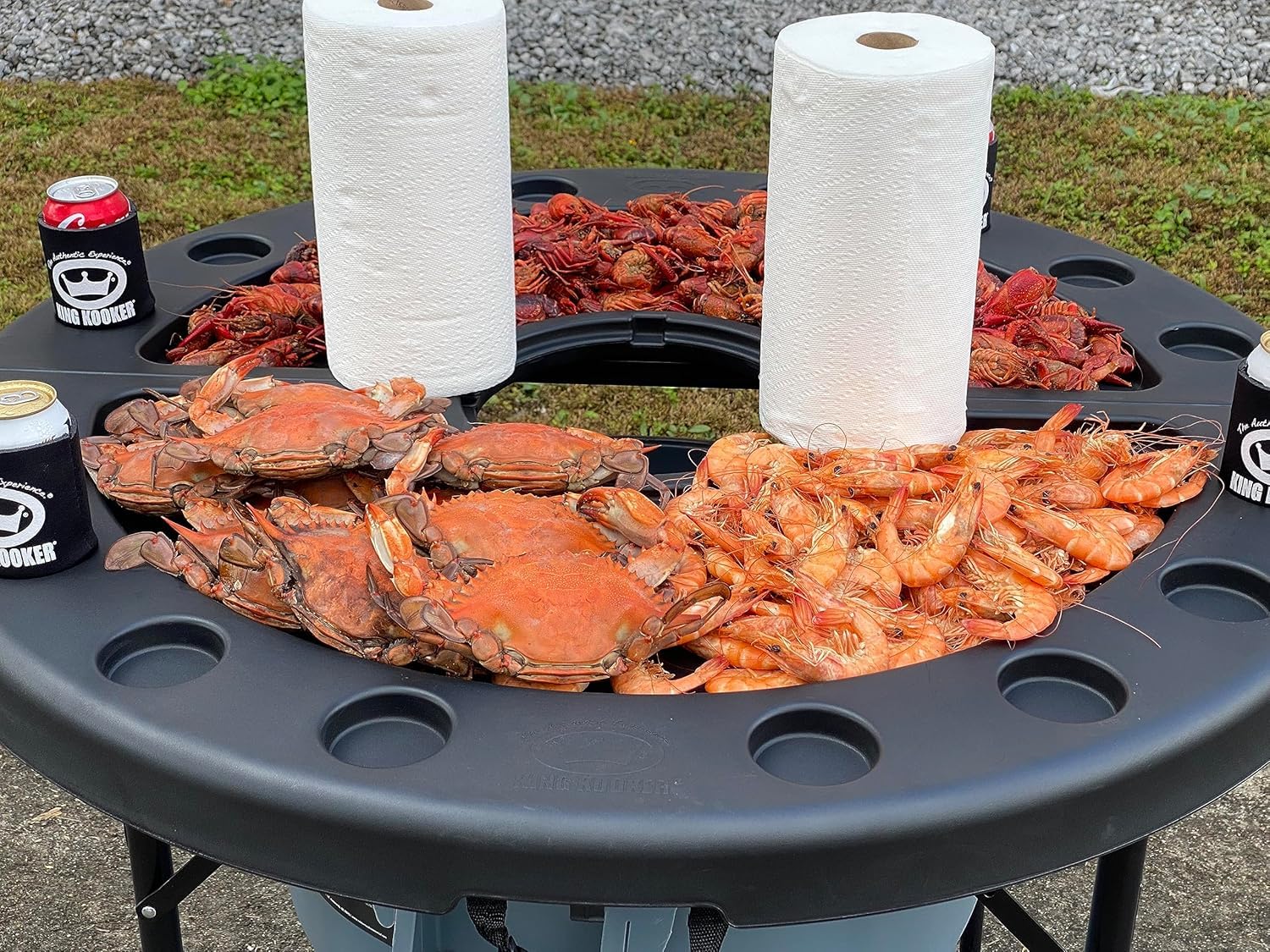 King Kooker table at a tailgate offering ample space for plates and towels.