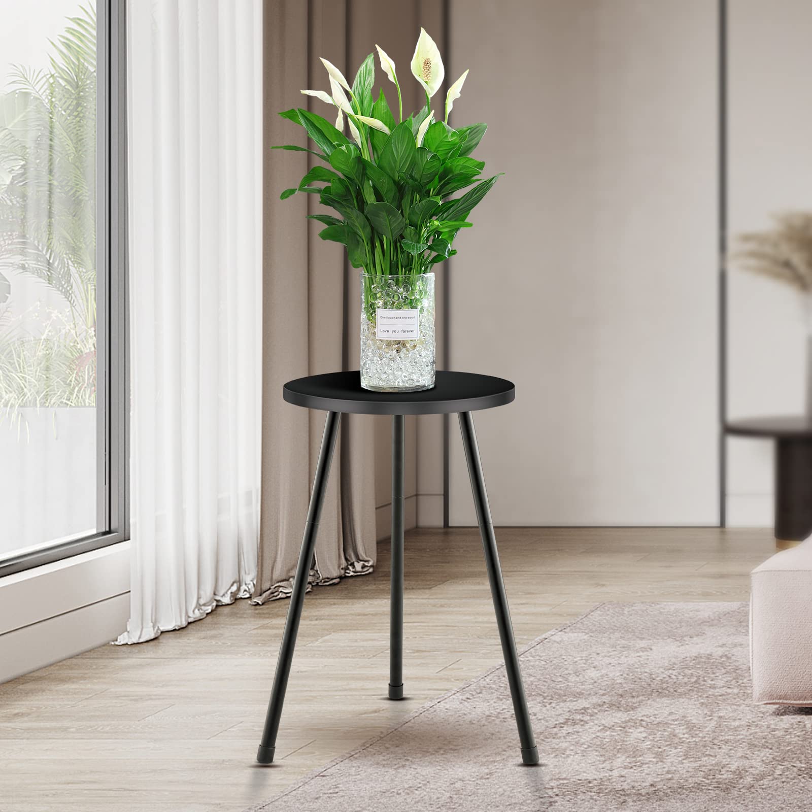 KINNARY tall plant stand side angle demonstrates adjustable height.