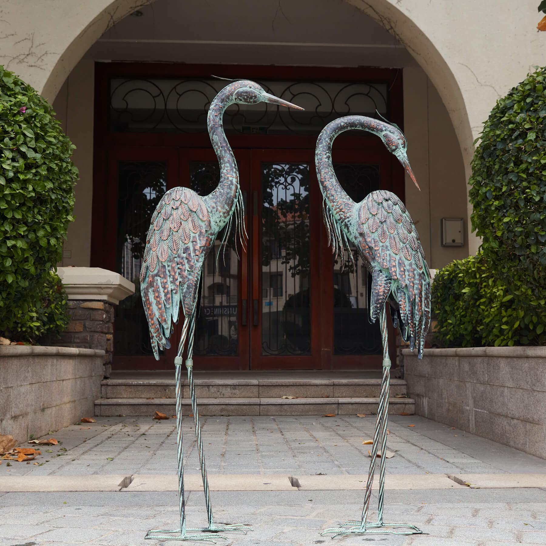 Kircust garden crane statue in standing pose adds elegant yard decor.