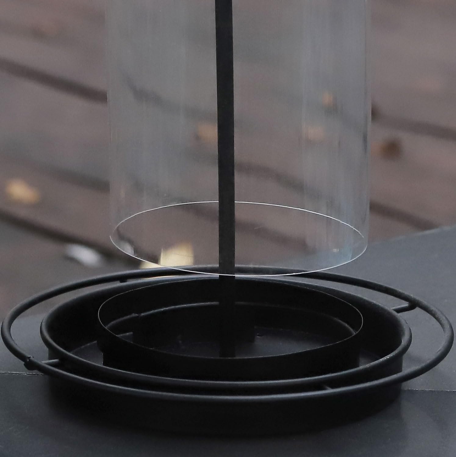 Durable black metal construction for outdoor year-round use.
