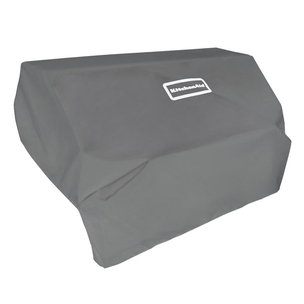 KitchenAid built-in head grill cover protecting an island grill from weather.